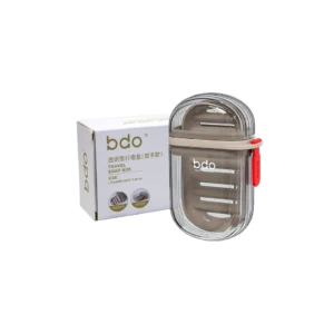 Portajabón de viaje BDO transparente con tapa gris, ideal para llevar jabón en cualquier lugar.