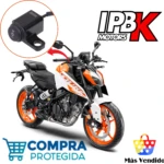 Mando interruptor Domino para exploradora led, negro, con logo y palanca ON/OFF, sobre motocicleta naranja y blanca.