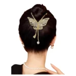 Pinza mariposa dorada con pedrería y perlas, para peinados recogidos.