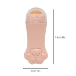 Rodillo facial rosado con forma de pata de gato y punta para absorber grasa, 7.5cm de alto, 3cm de ancho.