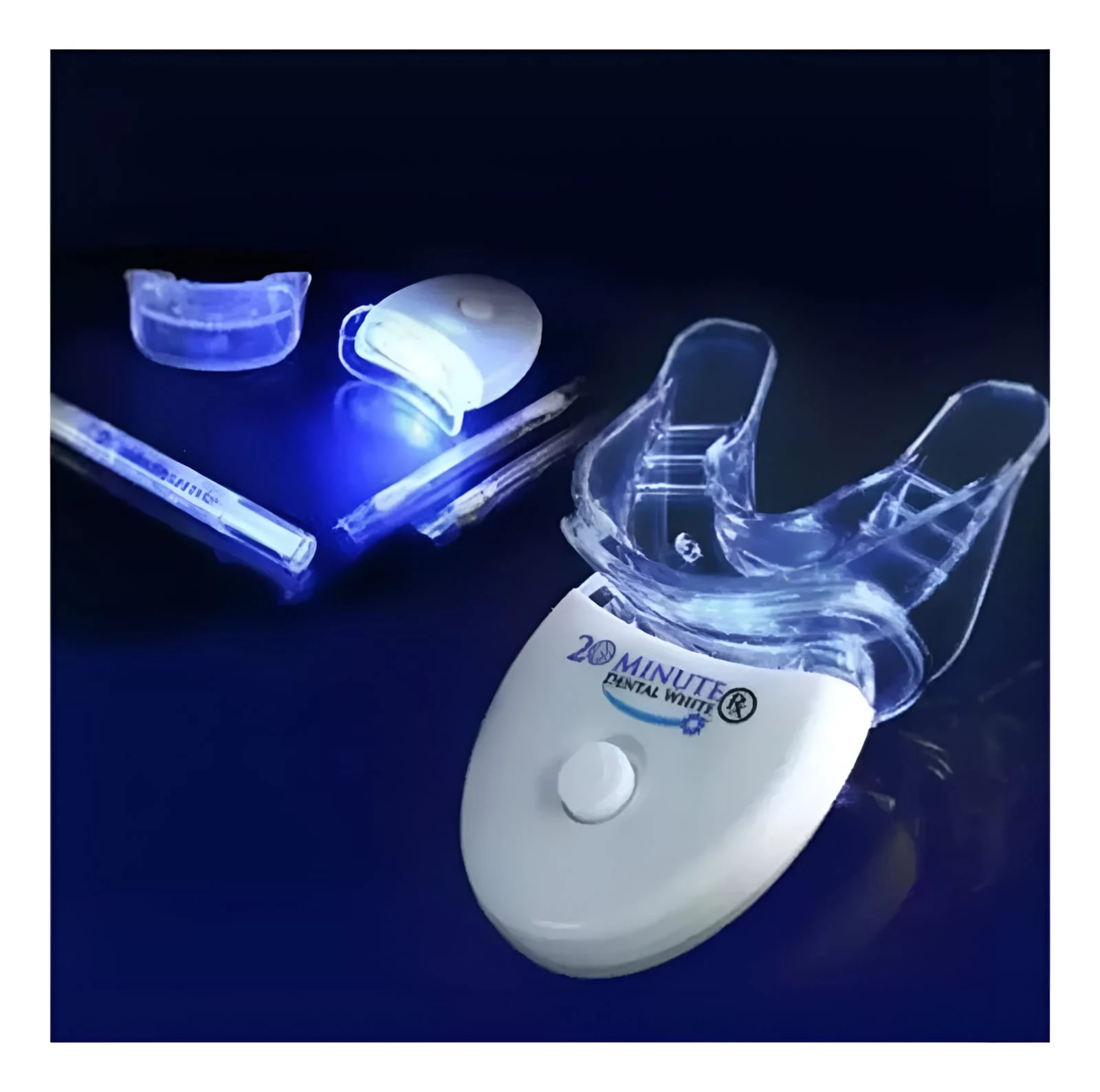 Kit de blanqueamiento dental 20 Minute Dental White con luz LED, cubeta de silicona, jeringas de gel blanqueador y accesorios sobre fondo azul oscuro.