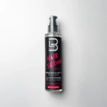Envase cilíndrico de 200 ml de suero capilar Level 3 con dispensador negro, etiqueta negra con letras rosa y beneficios detallados de aloe vera anti-frizz.