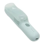 Cortadora de cabello para bebé VGR V-155 color verde menta con diseño ergonómico, succión integrada, botón de encendido y puerto de carga inferior.