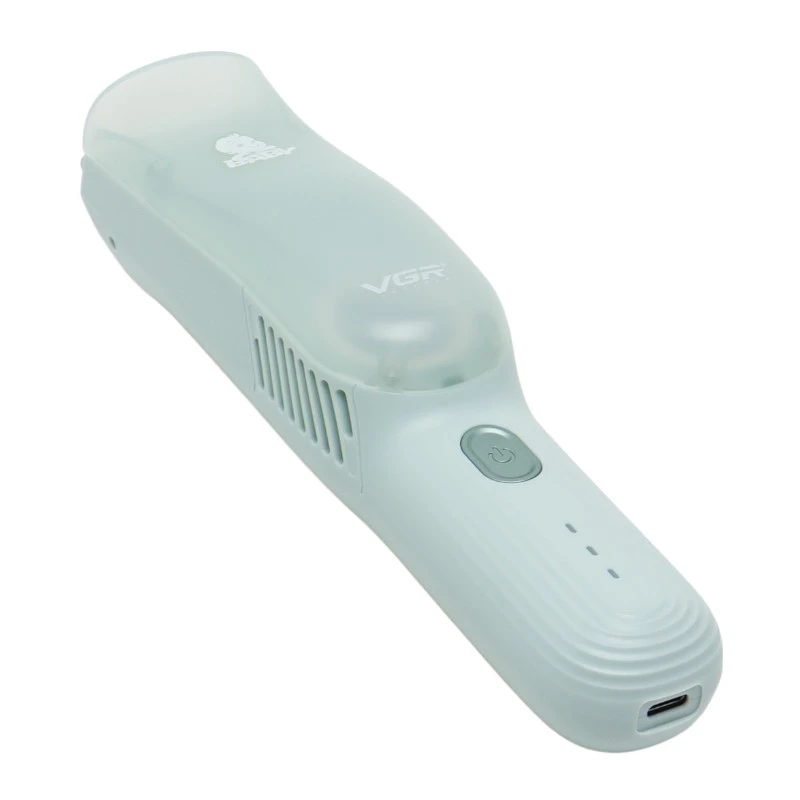 Cortadora de cabello para bebé VGR V-155 color verde menta con diseño ergonómico, succión integrada, botón de encendido y puerto de carga inferior.