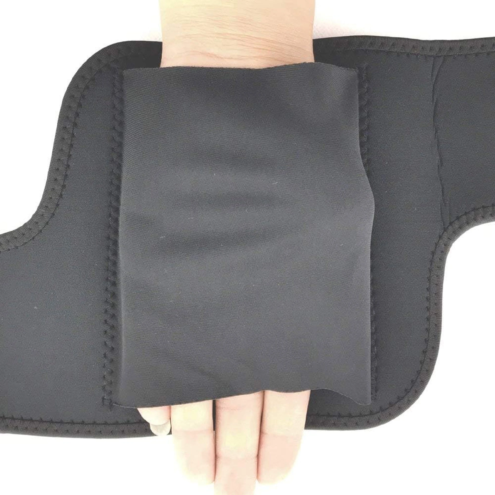 Codera ortopédica negra ajustable, protección para muñeca y mano, material neopreno.