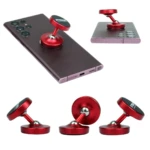 Soporte magnético rojo para celular, en trípode, sobre smartphone, ideal para grabar o ver contenido.