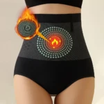 Panty faja control abdomen negro con diseño de puntos y símbolo de calor en la zona abdominal.