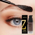 Tinte de cejas café Zephoco aplicándose en cejas oscuras, con envase y aplicador.