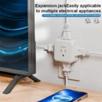 Extensor de enchufes blanco con 5 tomas, ideal para conectar múltiples electrodomésticos a la vez junto a un televisor y móvil cargando.
