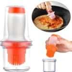 Dispensador de aceite con brocha de silicona naranja, ideal para cocinar y repostería.