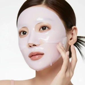 Mascarilla de gel PDRN salmón Medicube en rostro con efecto unificador de tono y fortalecedor de barrera cutánea.