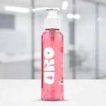 Bote dispensador rosa transparente de jabón líquido neutro Uro, con etiqueta blanca y texto.