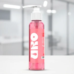 Bote dispensador rosa transparente de jabón líquido neutro Uro, con etiqueta blanca y texto.