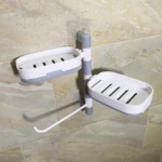 Jabonera doble de pared giratoria en blanco y gris, con drenaje y gancho, ideal para baño.