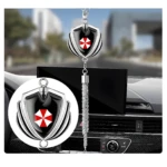 Adorno colgante plateado con escudo negro y logo rojo de paraguas, para retrovisor de auto.