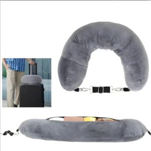 Almohada de viaje gris de terciopelo con compartimento secreto para equipaje y correas ajustables.