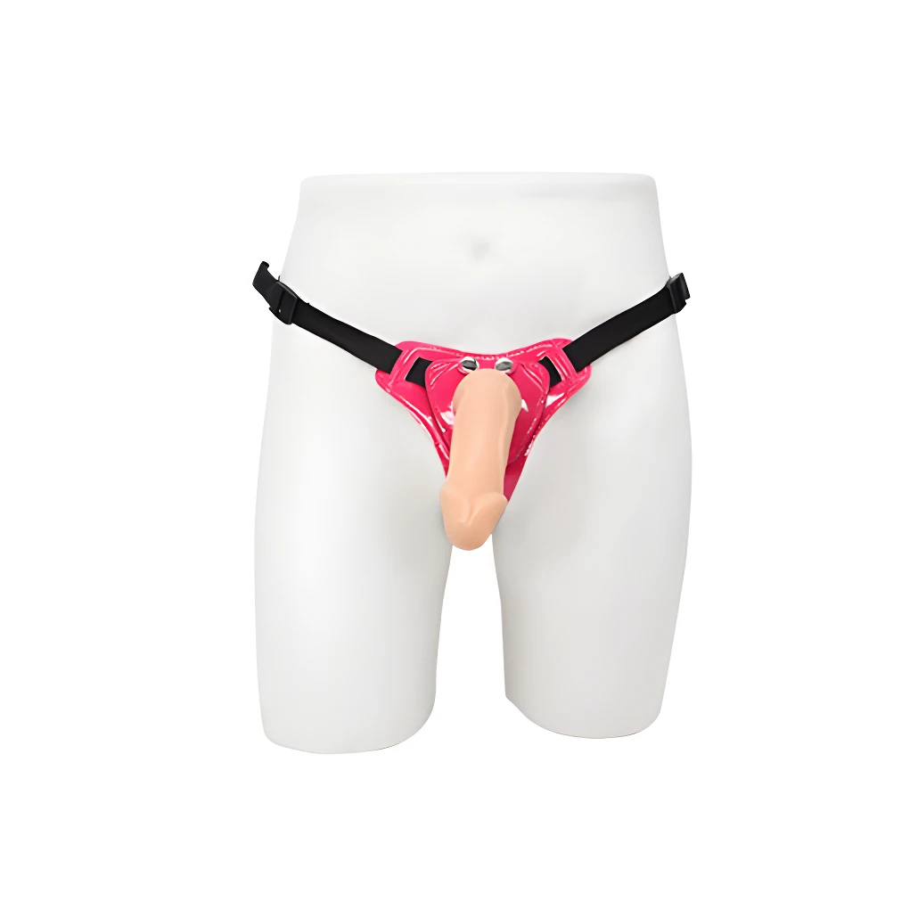 Arnés erótico rosado brillante con dildo de silicona color piel, adaptable a la cintura, para uso femenino.