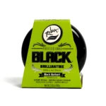 Cera capilar Rolda Black Brilliantine de 100g con empaque verde, ofrece fijación ligera y acabado brillante para camuflar canas en un formato compacto.