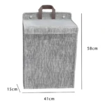 Cesto de ropa colgante plegable gris de 58x41x15 cm con tapa y asas, ideal para organizar espacios.