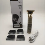 Cortadora de cabello Kezu T9 dorada con grabado de dragón, incluye cuatro guías de corte, cable de carga USB y caja de empaque con diseño profesional.