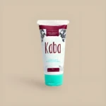 Crema corporal aclarante Kaba en tubo blanco con tapa turquesa, 60 mL, con diseño floral.