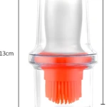 Dispensador de aceite transparente con brocha naranja para cocina, 13cm alto x 6cm ancho.