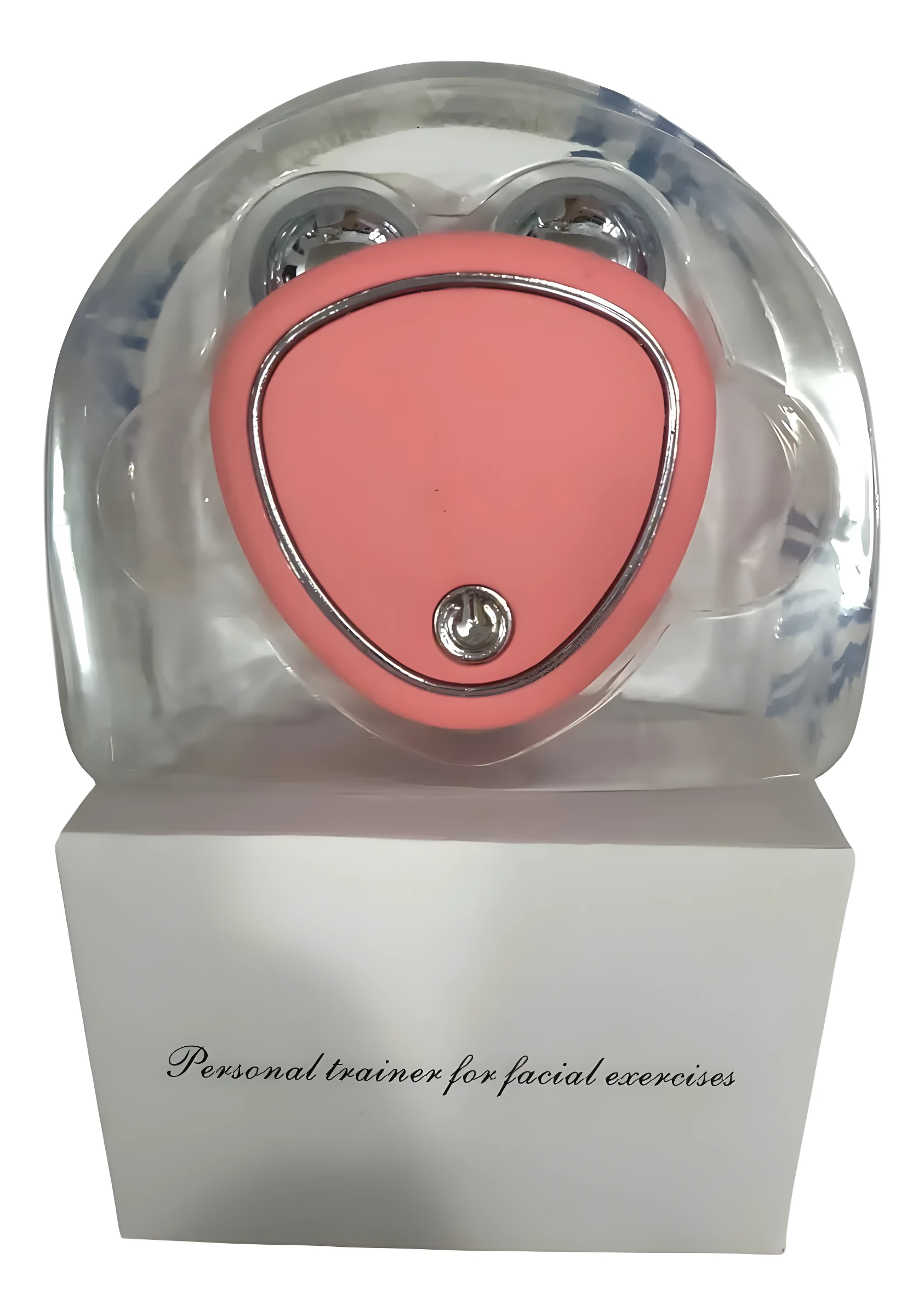 Gimnasia Facial Estimulante Electro en forma de corazón color coral con botón de encendido metálico, sobre caja blanca con texto.