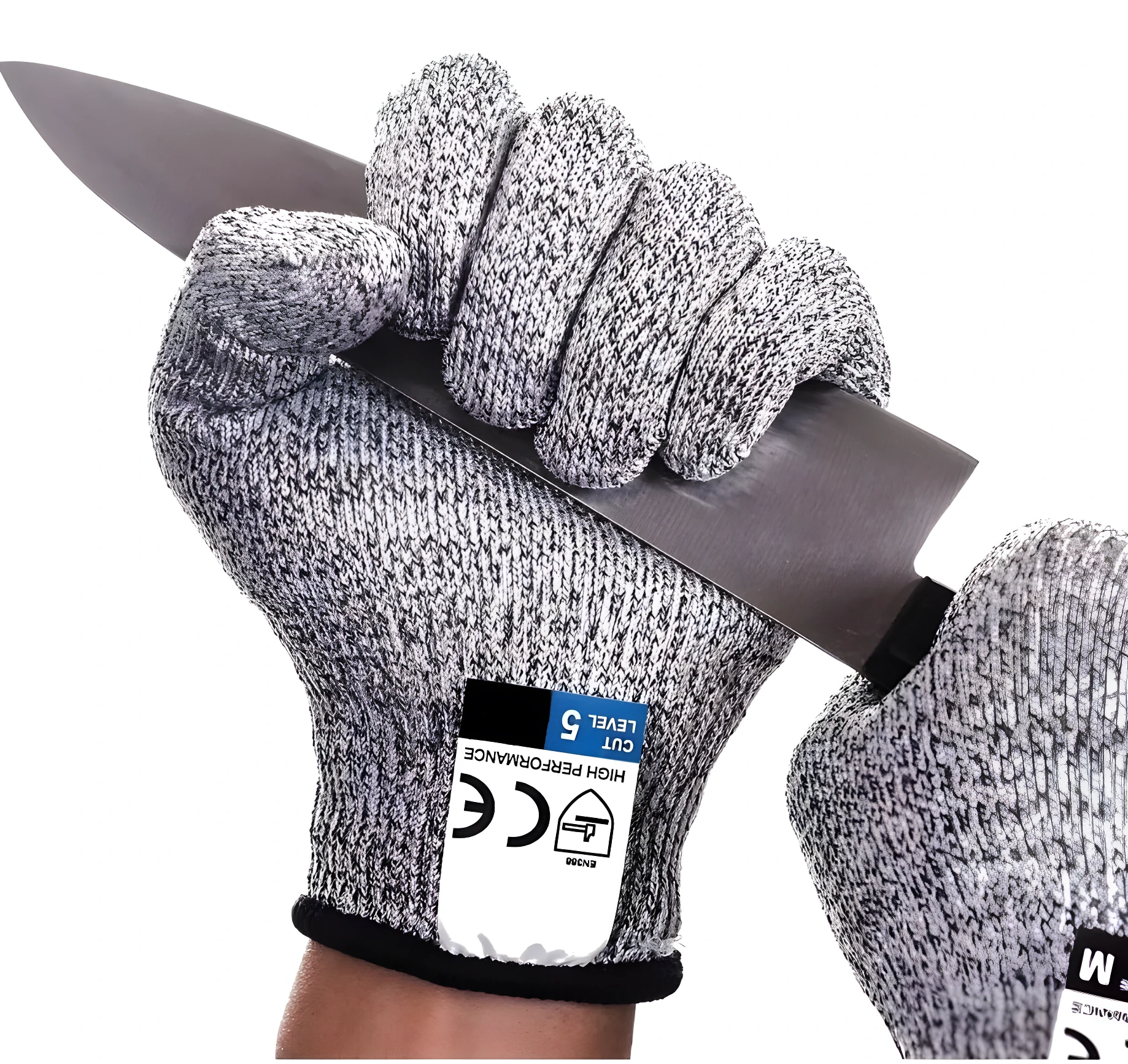 Manos con guantes anticorte Nivel 5 de textil sujetando cuchillo de chef.