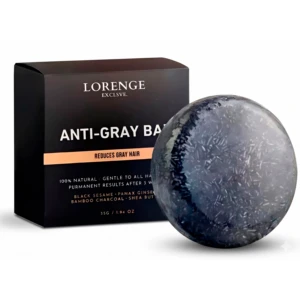 Jabón antigray de Lorenge Exclusive, esfera azul oscuro con textura granulada, junto a su empaque negro que indica reducción de canas y ingredientes naturales como bambú y ginseng.