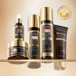 Kit Retinol Sadoer con crema, loción, suero y limpiador en envases dorados y negros, ideal para reafirmar y suavizar la piel.