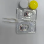 Set x2 lentes de contacto de fantasía tipo ojo con pinza y estuches.