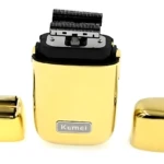 Afeitadora eléctrica Kemei dorada con cabezal de corte expuesto, acompañada de su lámina de repuesto y tapa protectora sobre fondo blanco.