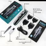 Máquina cortapelo VGR-075 negra y turquesa con pantalla LED, accesorios y caja.