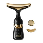 Masajeador facial 3 en 1 negro y dorado. Incluye cabezal curvo y redondo para rostro y cuello.