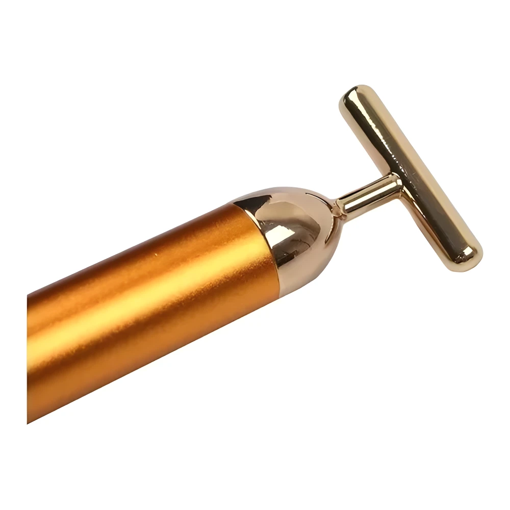 Masajeador facial dorado con rodillo T, ideal para rejuvenecimiento y firmeza de la piel.