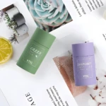 Mascarillas faciales en barra YTSL verde y morada, una de té verde y otra de berenjena.