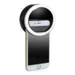 Mini aro de luz circular recargable blanco y negro, montado en smartphone dorado para selfies.