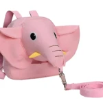 Mochila arnés de seguridad infantil rosa con diseño de elefante y correa ajustable, ideal para mantener cerca a los niños.