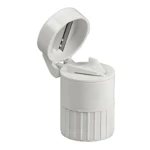 Pastillero circular blanco con cortador integrado, ideal para dividir y organizar medicamentos.