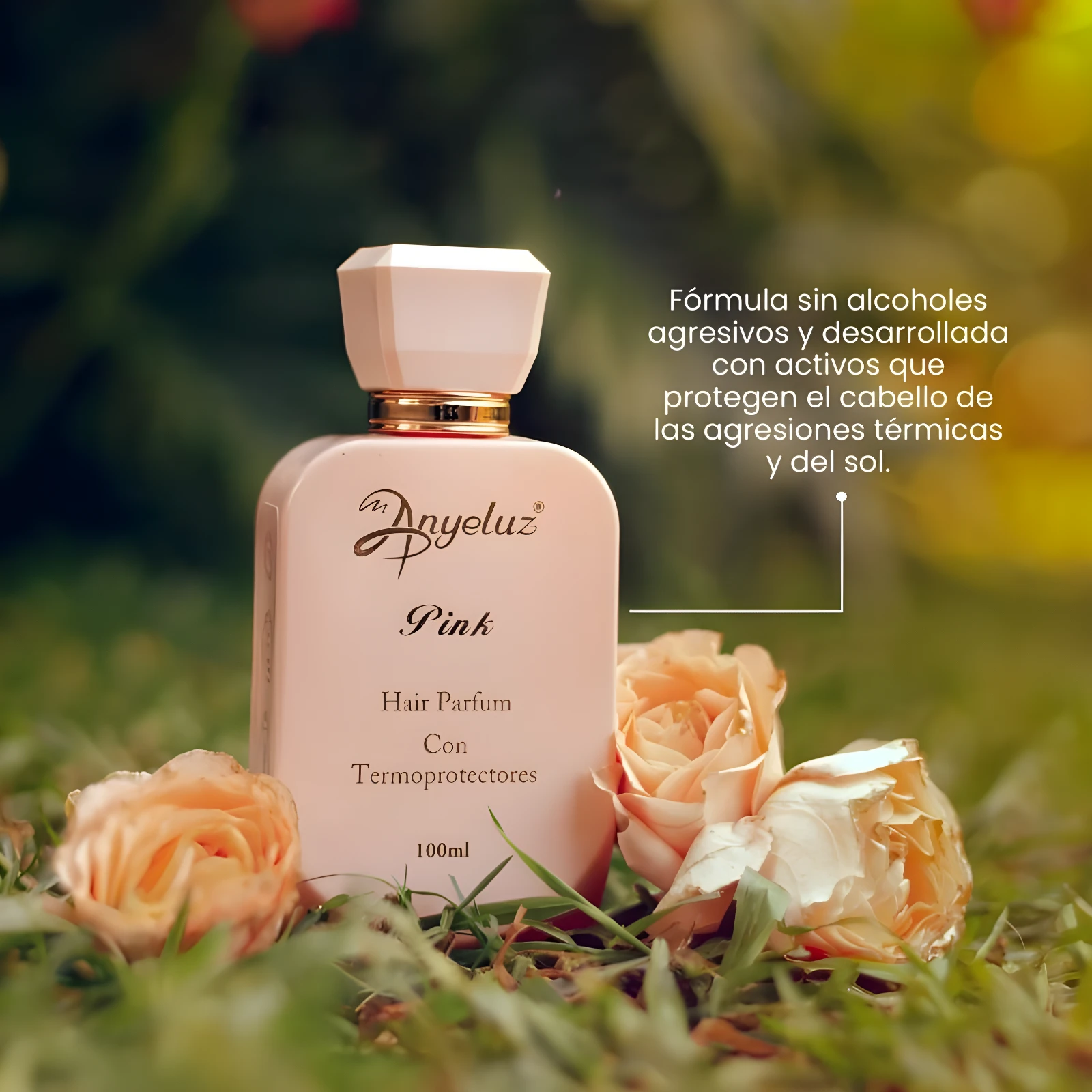 Perfume capilar Anyeluz Pink 100ml con termoprotectores, rodeado de rosas, en fondo verde.
