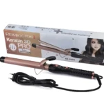 Pinza rizadora Keratina 3D Pro color oro rosa con mango negro texturizado, junto a su caja rectangular que incluye modelo RE-2502 y cable de alimentación.