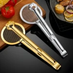 Pinzas de cocina doradas y plateadas con colador incorporado y diseño de patita, ideales para freír y servir alimentos.