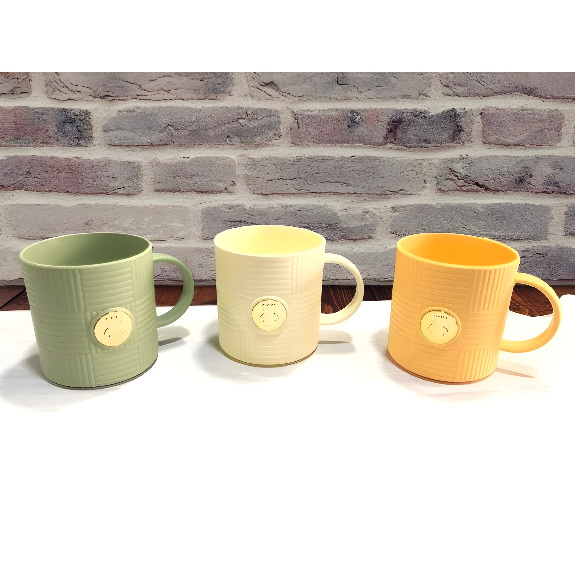 Set x2 pocillos verdes, beige y naranja con relieve y sello dorado, ideales para cocina.