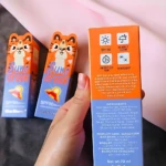 Caja naranja de protector solar "Suns creen" con diseño de tigre, SPF90, multi-reparación y blanqueamiento.