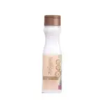 Botella de shampoo Milagros blanco con tapa marrón, etiqueta con texto y gráficos de botánicos.