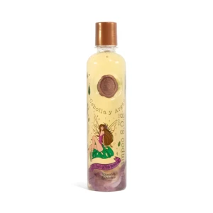 Shampoo transparente Ritual Botánico con ingredientes como cebolla y argán, botella con hada y detalles florales. 400 ml.