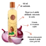 Botella de shampoo SOS Ritual Botánico 400 ml con cebolla y argán, enfocado en fortalecer y estimular el crecimiento capilar, con dos mitades de cebolla roja al lado.