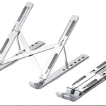 Set x2 soportes metálicos plateados para portátil, ajustables y plegables, con base antideslizante.
