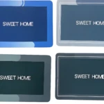 Set x2 tapetes absorbentes "Sweet Home", uno azul y uno gris oscuro.