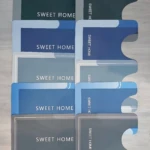 Tapetes Duo Absorbente en tonos azul, gris y verde con texto "SWEET HOME".